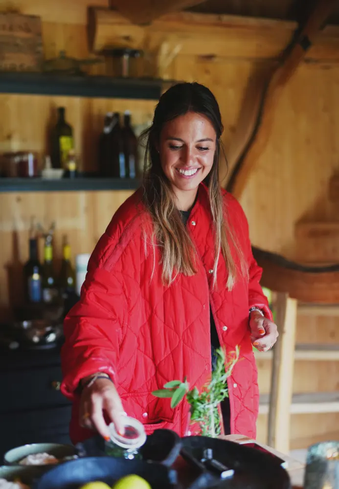 Sofia of The Brunch Tribe cooking in a mountain hut kitchen